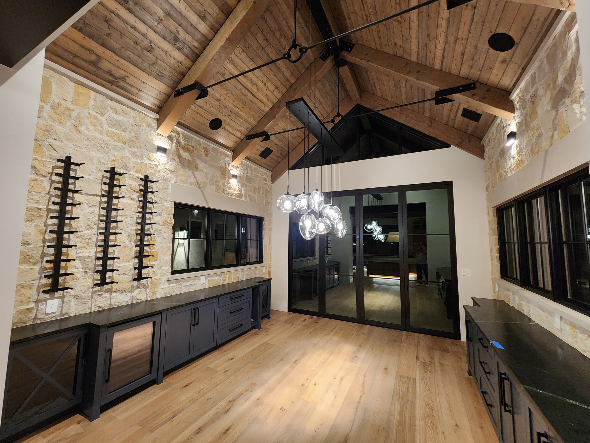 Stone-walled room with a wood ceiling